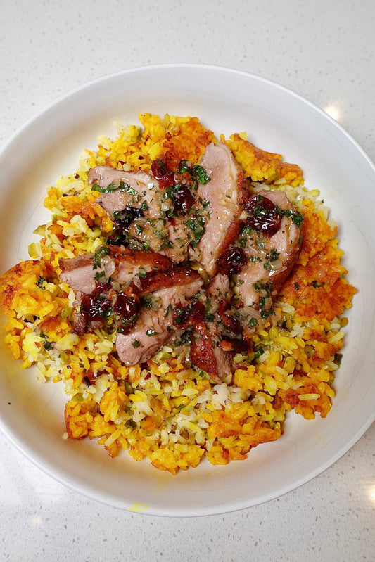 Crispy Duck Breast with Pistachio Orange Rice and Cherry Sauce