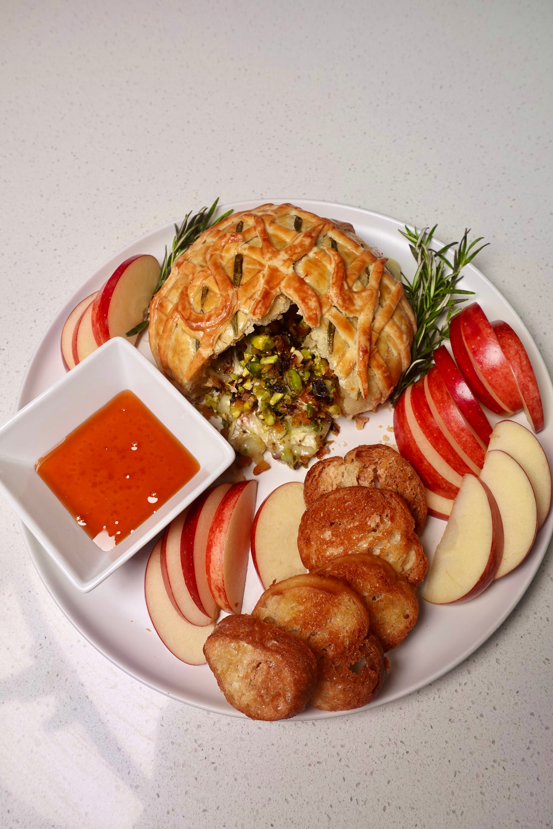 Baked Brie en Croûte with Pistachios, Apricots, Cherries, and Hot Honey